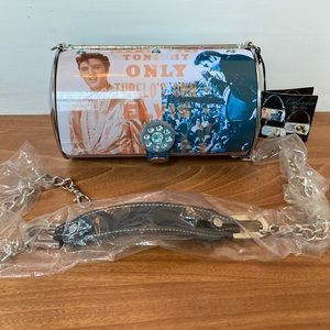 NWT Elvis Presley cylinder tin purse. Never used. Detachable shoulder strap.